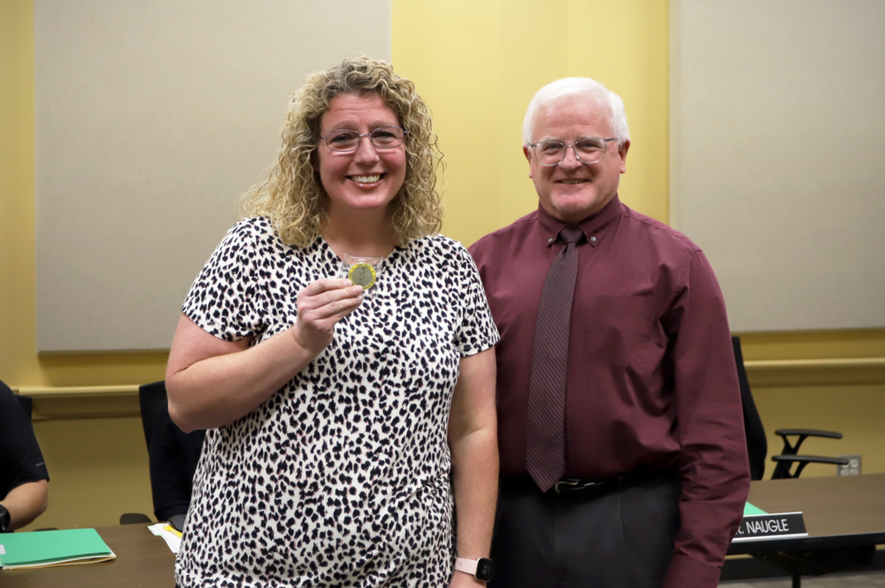 Mike Mullins presents Barbie Jackson with Coin of Excellence