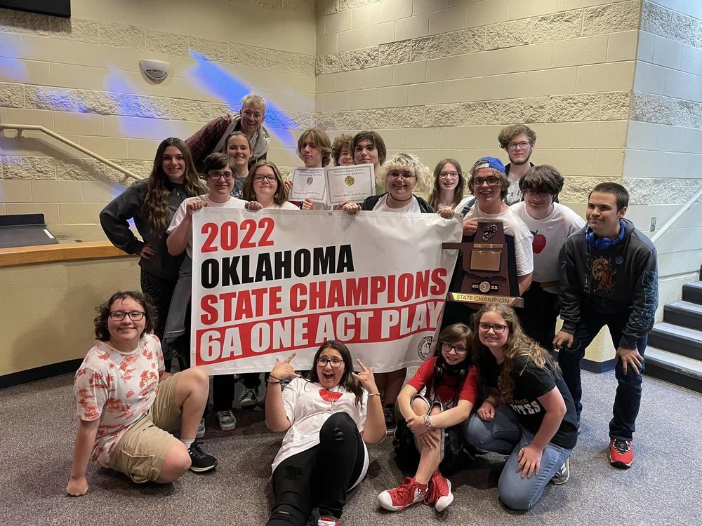 Sand Springs drama students pose with their plaque, banner reading :2022 Oklahoma state champions 6A One Act Play"