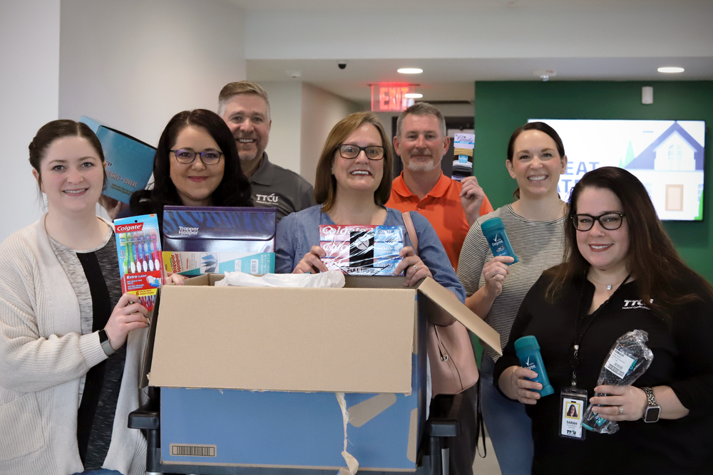 TTCU Federal Credit Union Employees donate supplies for homeless students